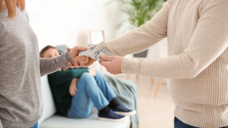 Man giving alimony to his ex-wife at home