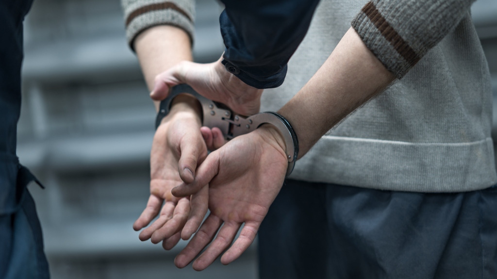 handcuffs on the prisoner