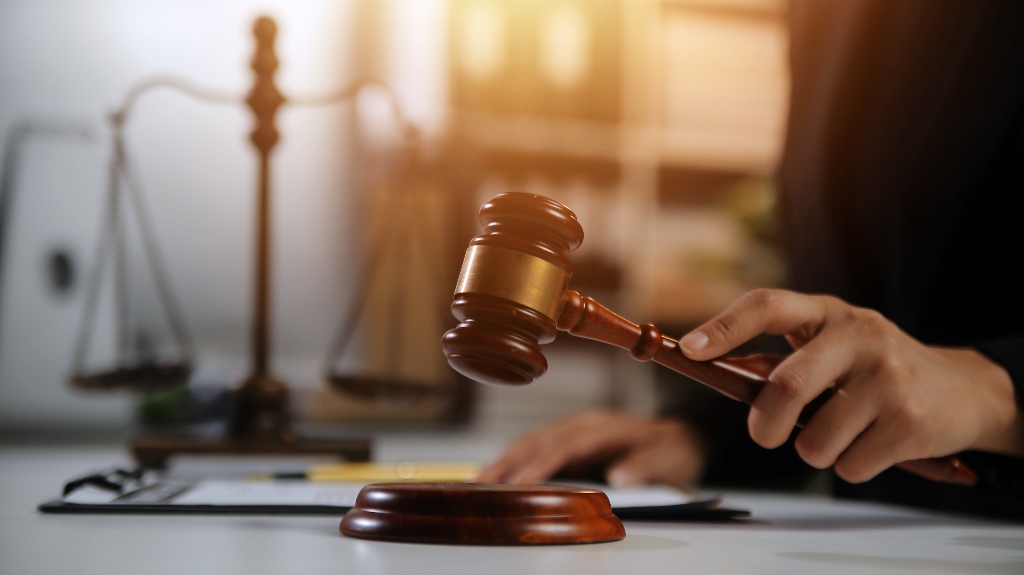 lawyer holds a judge's gavel in his hand